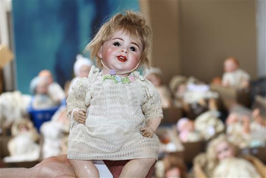 An SFBJ 23b doll,10in., firing fault to rim of head and a Heubach bisque baby, 5in.